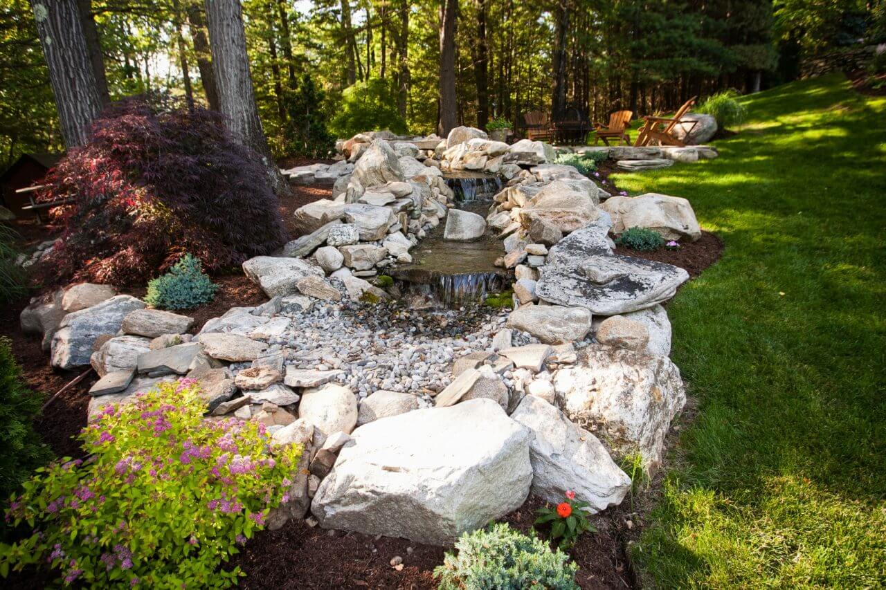 In a pondless waterfall, water is recirculated to create an aesthetic landscape feature, produce the soothing sound of moving water, and provide a water source for small and beneficial animals such as frogs, butterflies and bees.