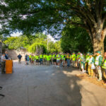 group of volunteers listening to remarks from the National Parks Service